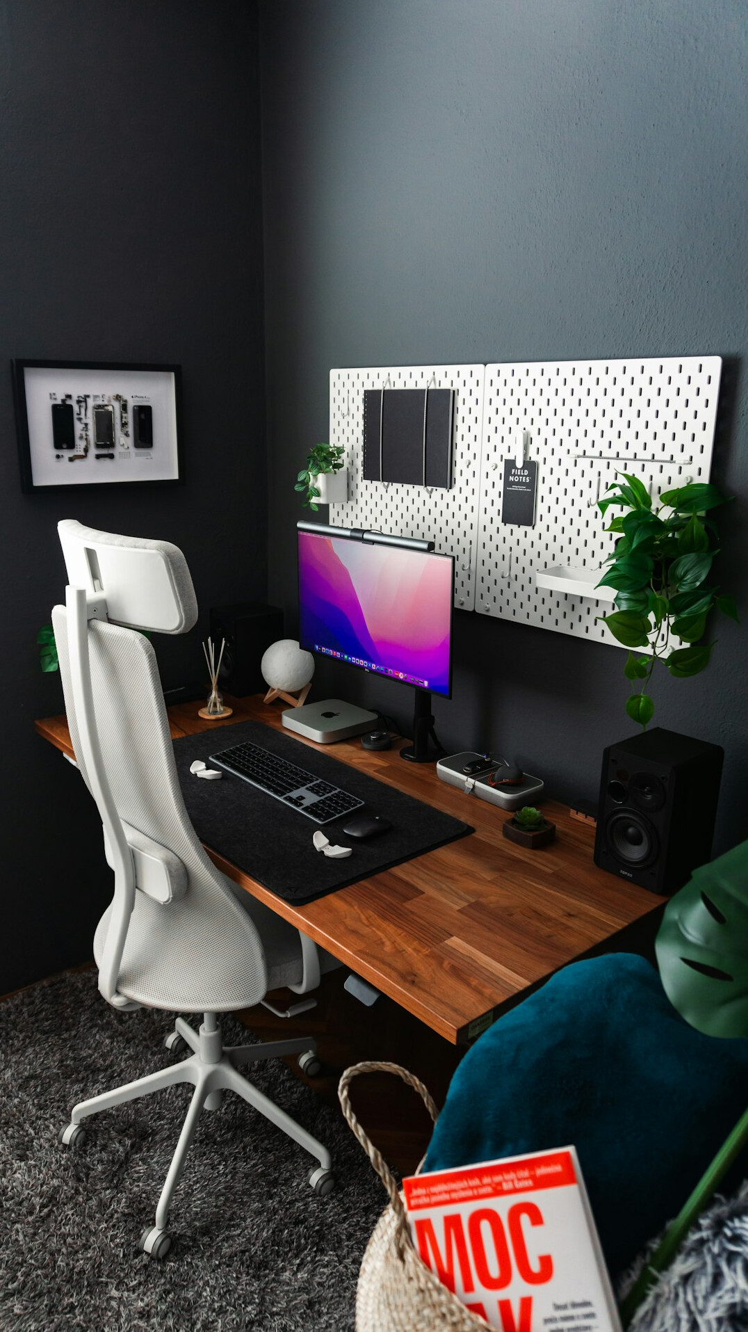 Cozy writer's home office with bookshelves, desk lamp and typewriter